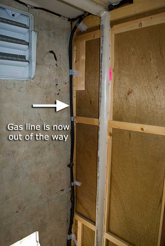 The old LP (gas) line plugged off, secured and out of the way
