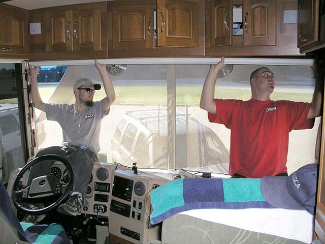 Windshield shade installation