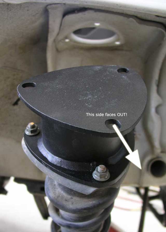 Mounted strut spacer at top of strut